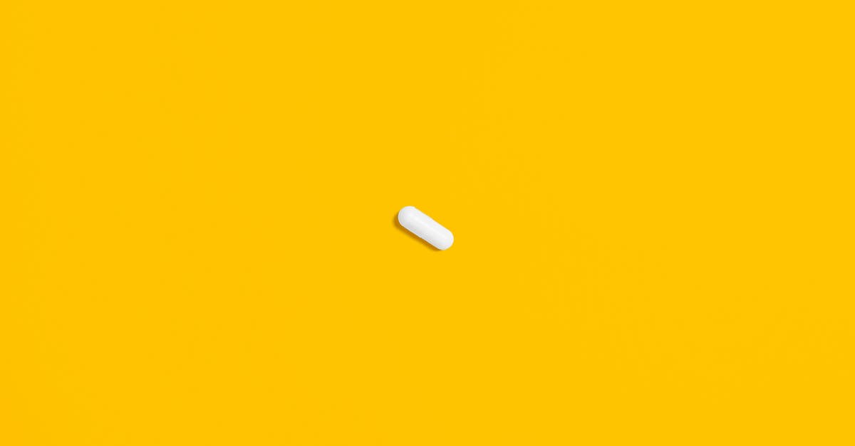 Domino One (2005), does it exist? - White Pill on Yellow Surface