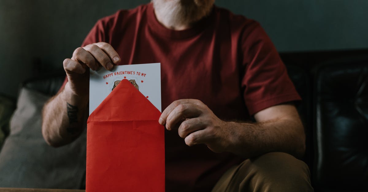 Elderly man sending postcards to random addresses during wartime [closed] - A Man Putting a Valentines Letter in a Red Envelope