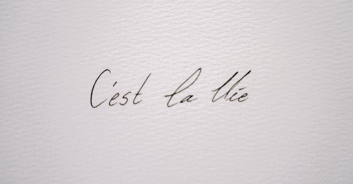 Exact french quote meaning "To want something you have to be alive" - Close-Up Shot of a Quote on a Paper