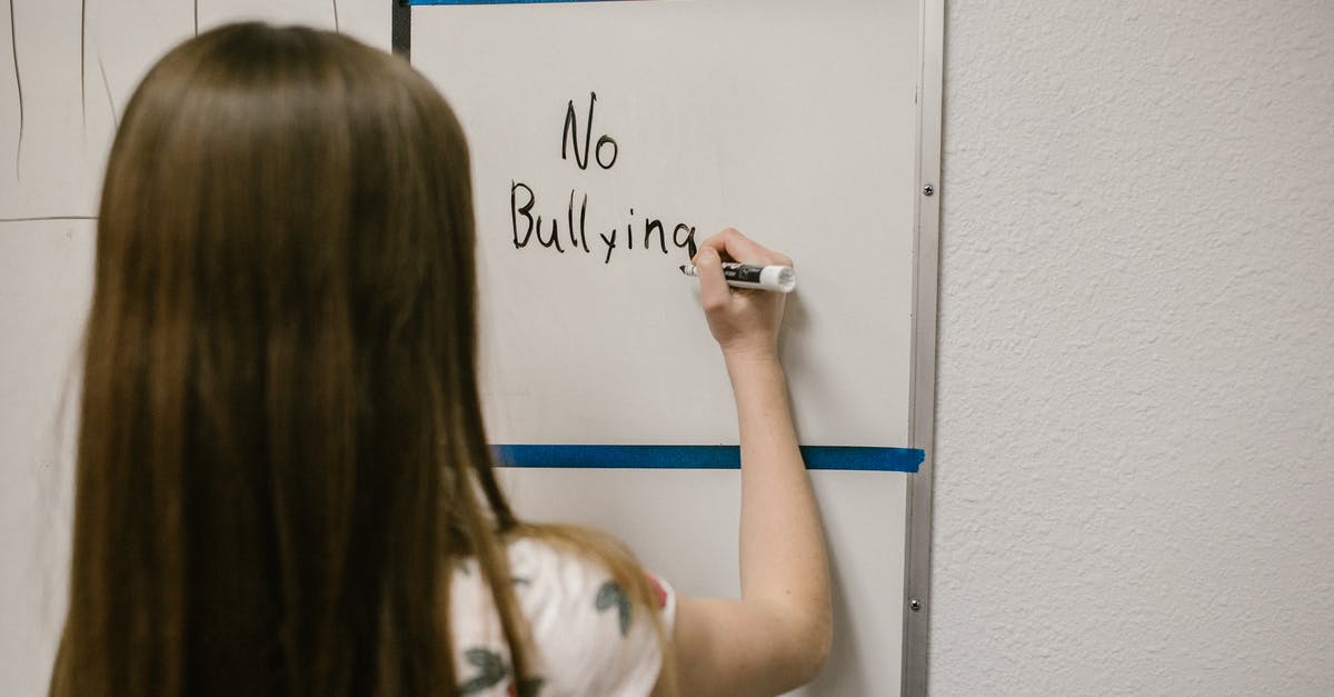 Fate of Miss Justineau in "the Girl with All the Gifts" - Girl Writing a Message Against Bullying on a White Board