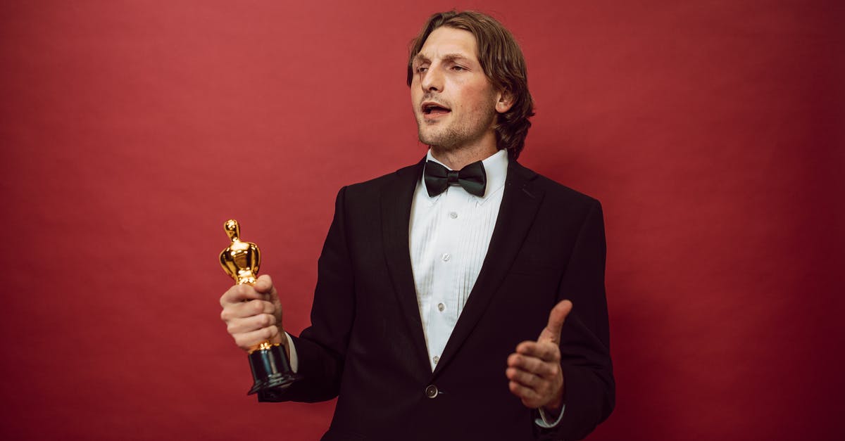 First Best Actor Oscar for war movie - A Proud Man Holding an Award