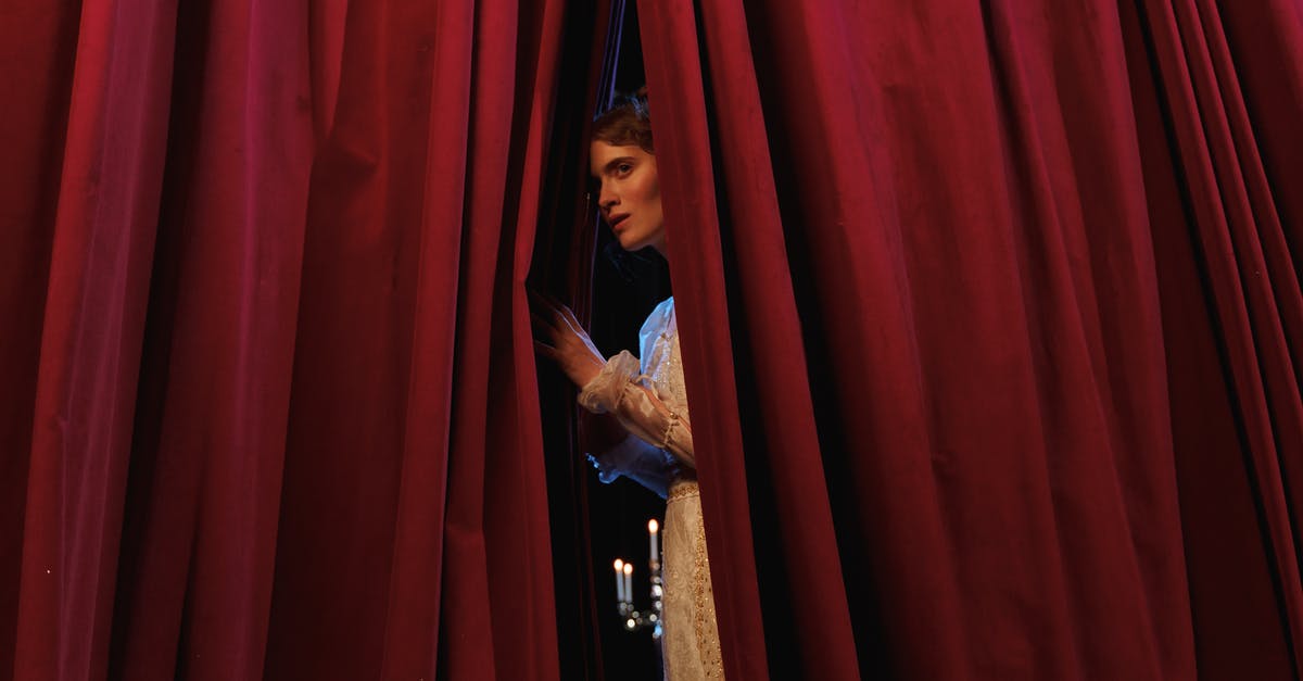 Has there ever been a drama film with an unreliable death scene confession? - Woman Standing Behind Red Curtain