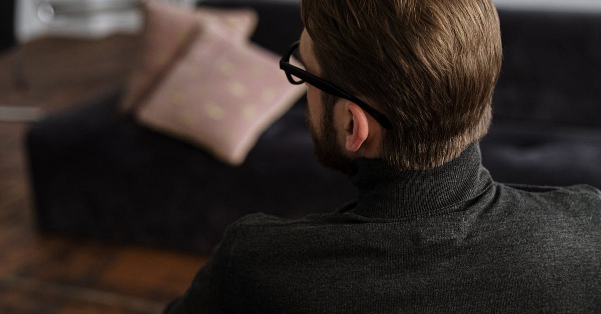 Have Finch's back problems been explained? - Man in Black Sweater Wearing Black Framed Eyeglasses