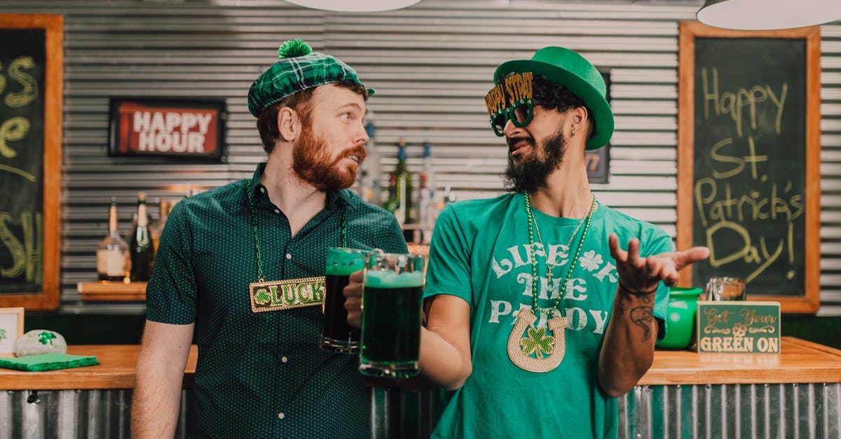 Have Patrick Jane and Kim Fischer slept together while on the island? - Positive young multiethnic men chatting and drinking beer in pub on Saint Patricks Day