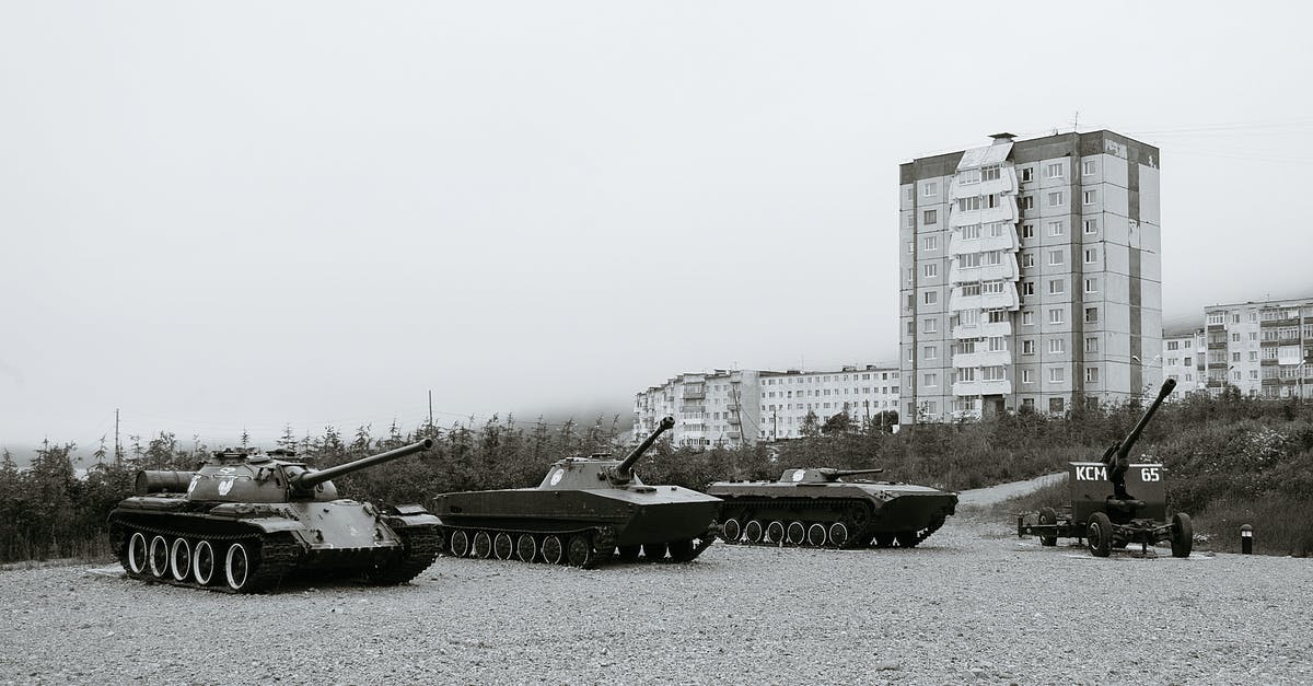 History of the World Pt. 2 - Black and white of monuments of various military vehicles on square in city