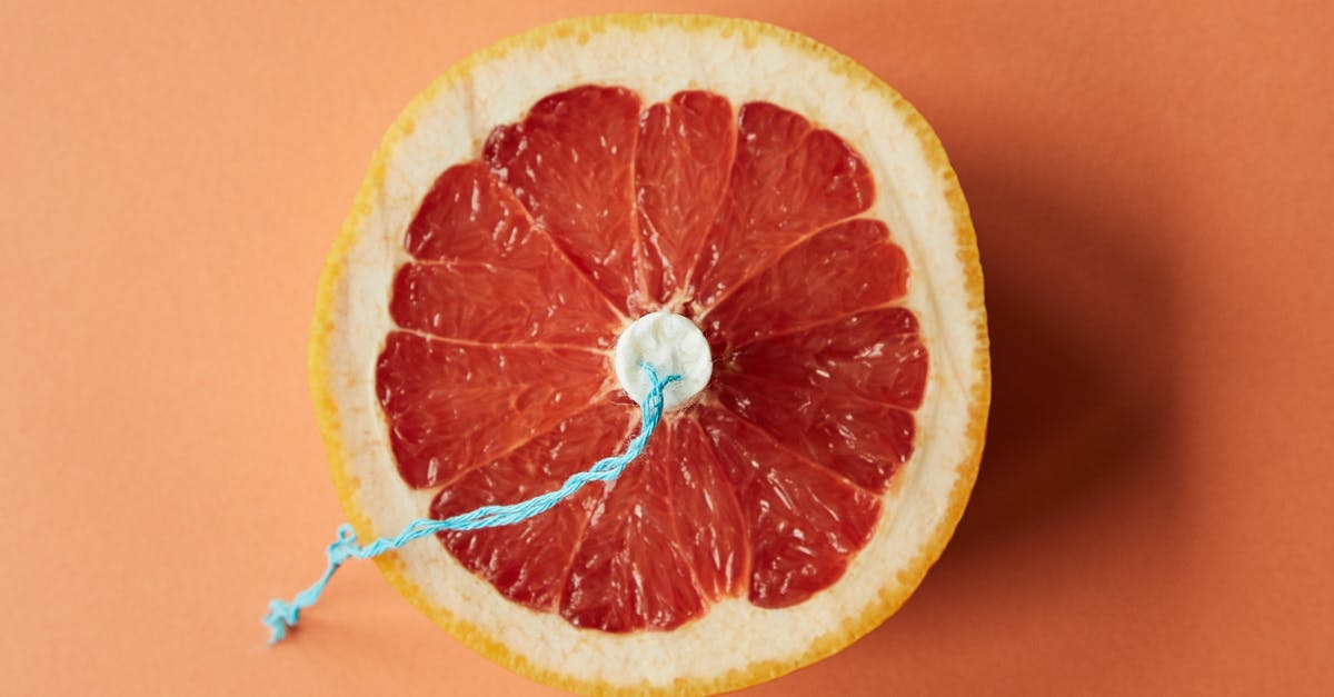 How are period food wrappers sourced or produced? - Sliced grapefruit with tampon as symbol of menstruation