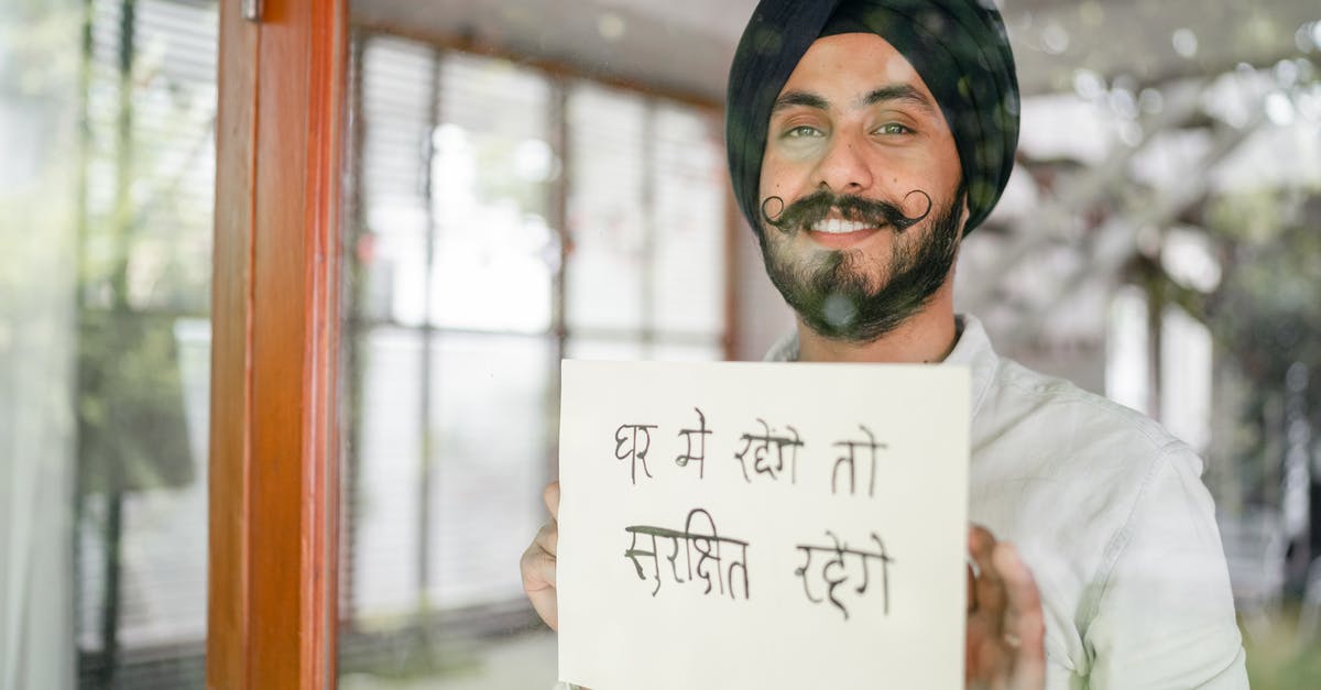 How can Beth call in sick for school when she is a national celebrity? - Content Indian guy showing paper with Hindi inscription