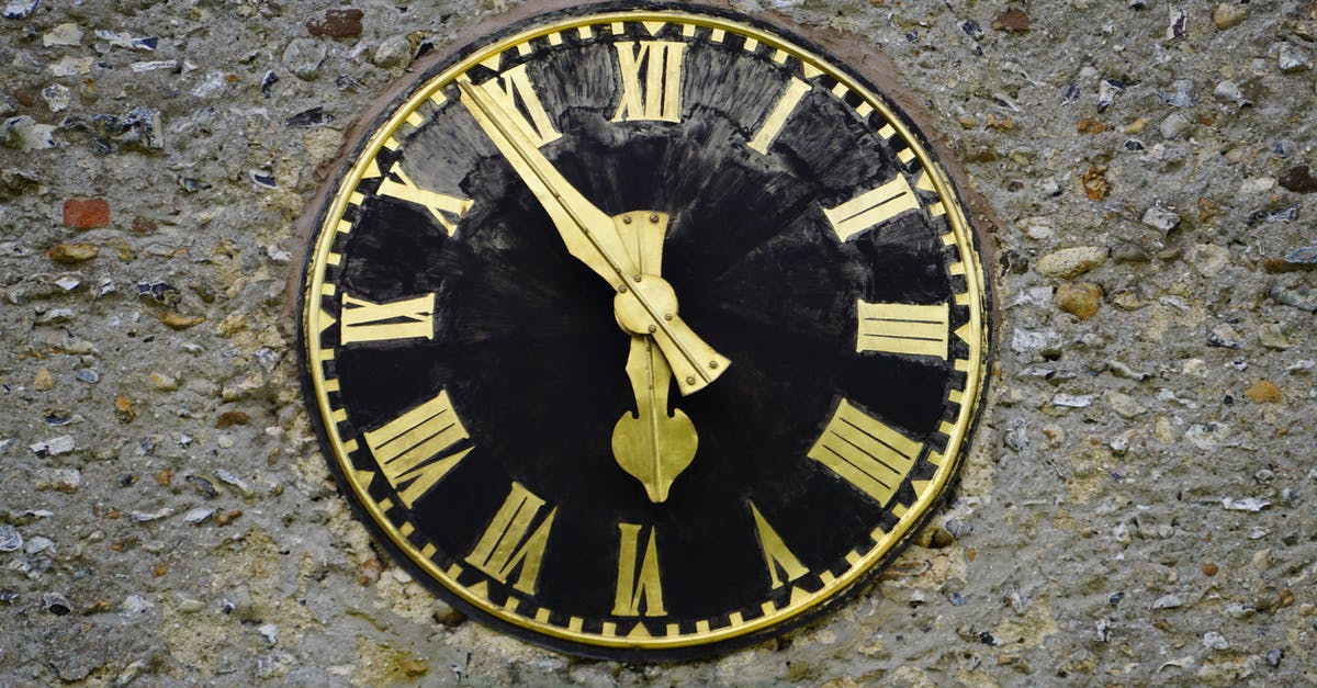 How can Dr. Strange use the Time Stone to do this? - Round Black and Yellow Analog Clock
