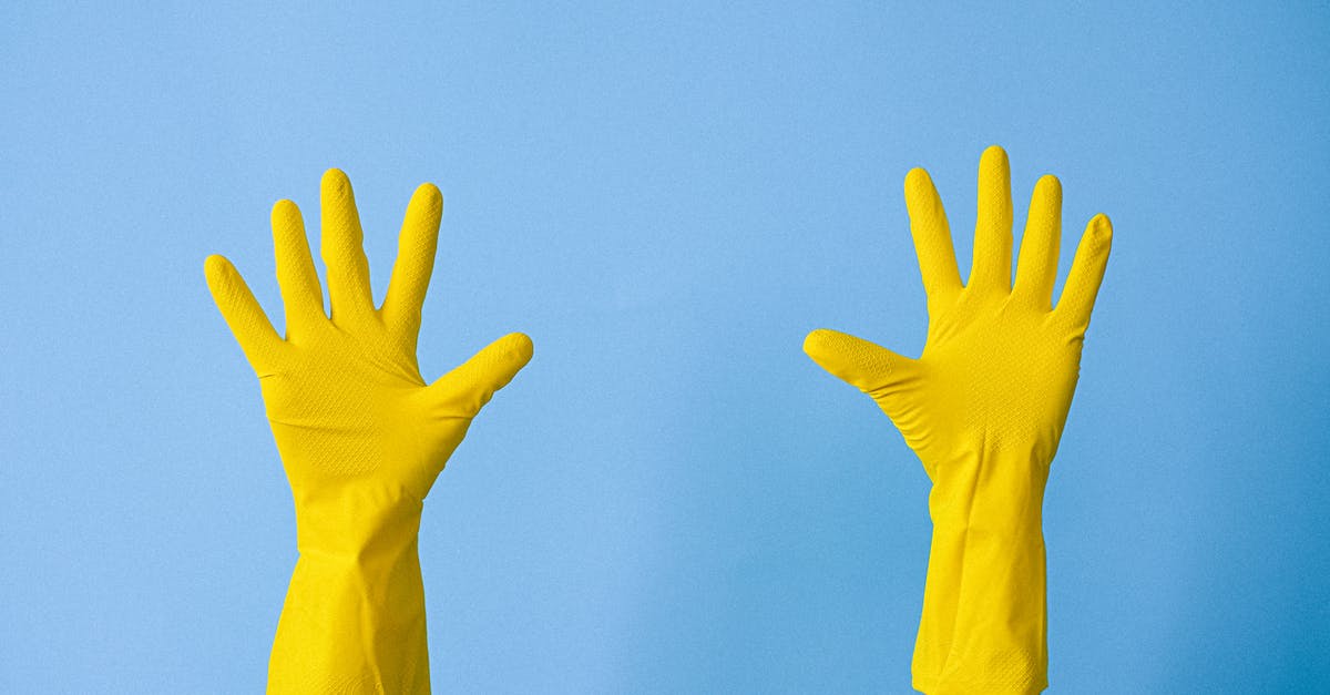 How can Ted show a finger? - Crop unrecognizable person in rubber gloves raising arms