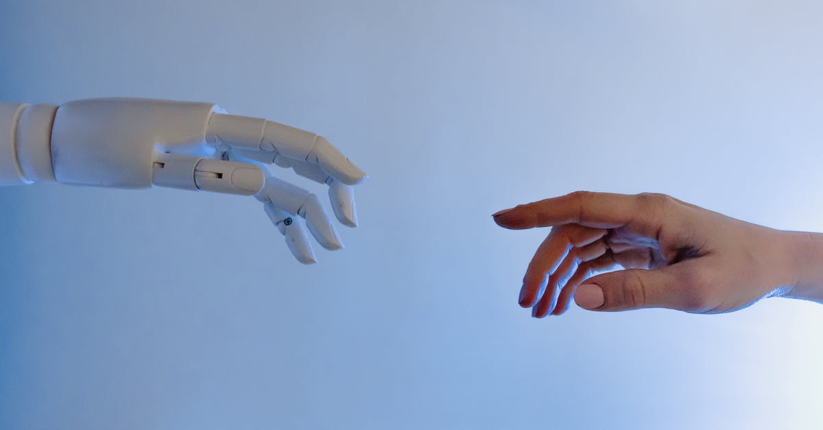 How can the A.I. robot charge its battery? - Person Reaching Out to a Robot