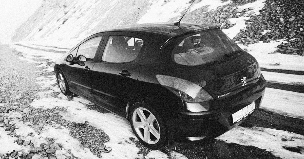 How come Dom's car not turned off when he uses the EMP? - A Car Parked on the Snow Covered Mountain Road