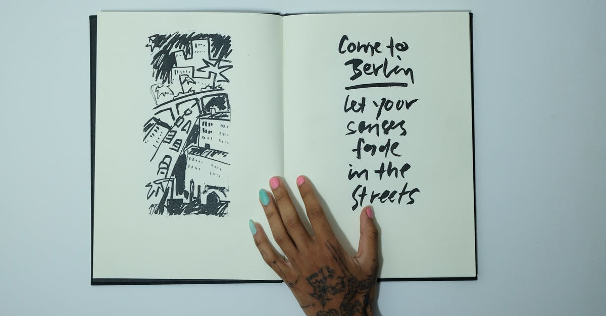 How come Marcus didn't know this about himself - Unrecognizable woman with opened sketchbook with inscription and drawing