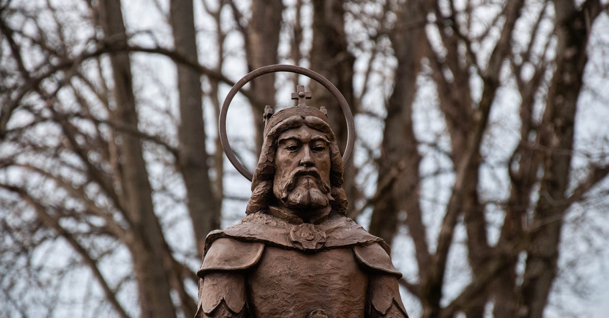 How could Captain Jack Sparrow die if he stole a crown from the island? - Ancient sculpture of holy warrior in park