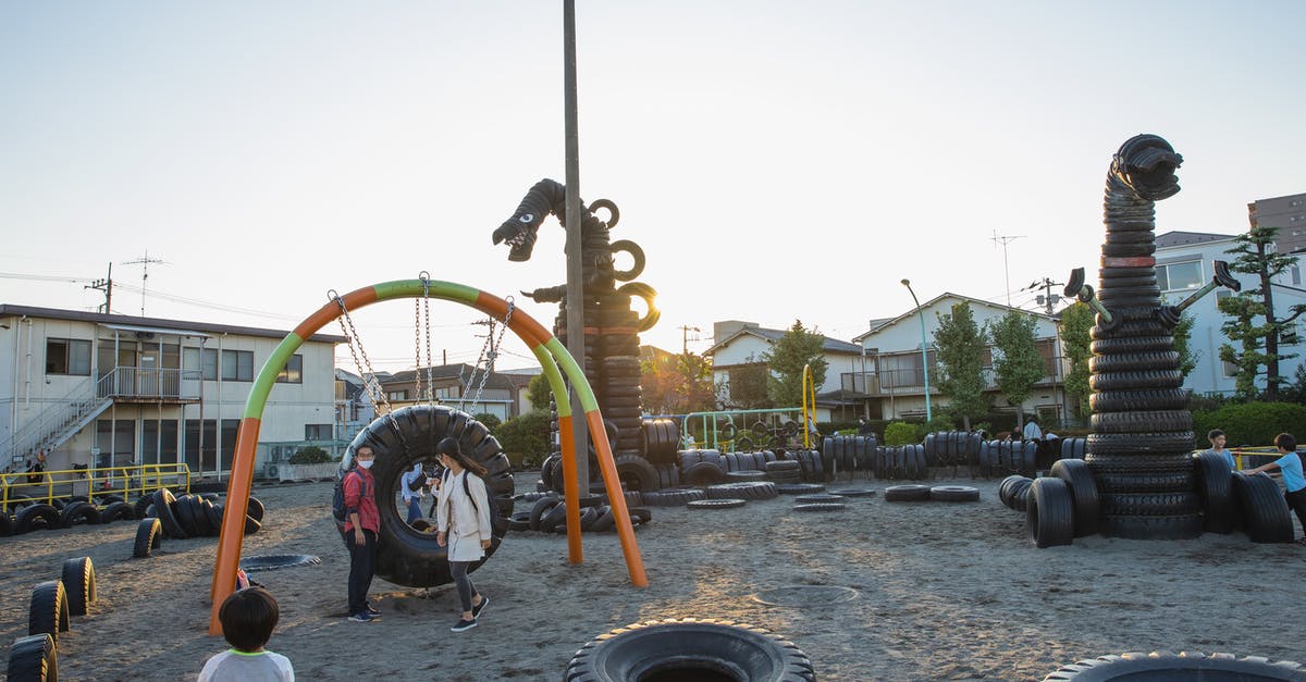 How could "It" lose to a bunch of kids? [duplicate] - Small yard with huge monster creature figures constructed of old tyres on playground full of children