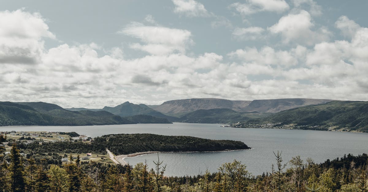 How Could Superman Lift the Oceanliner Out of the Water While He Was Surrounded by Kryptonite? - Panoramic View of Lake Surrounded by Hills and Mountains