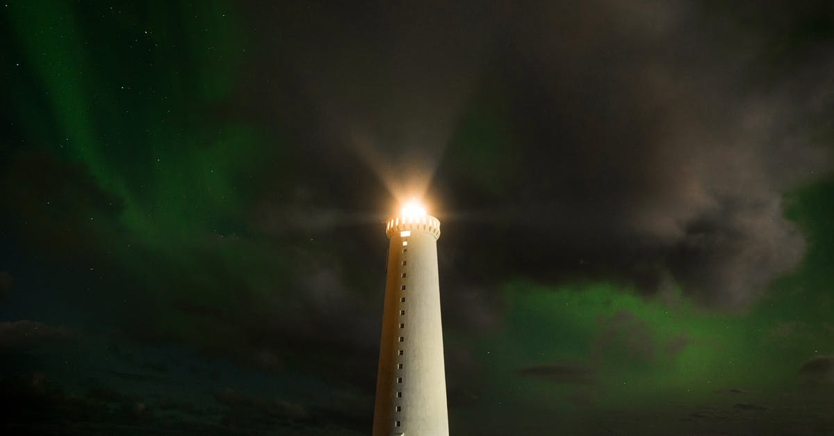 How did a signal turn the ship around? - Lighthouse tower in cloudy night