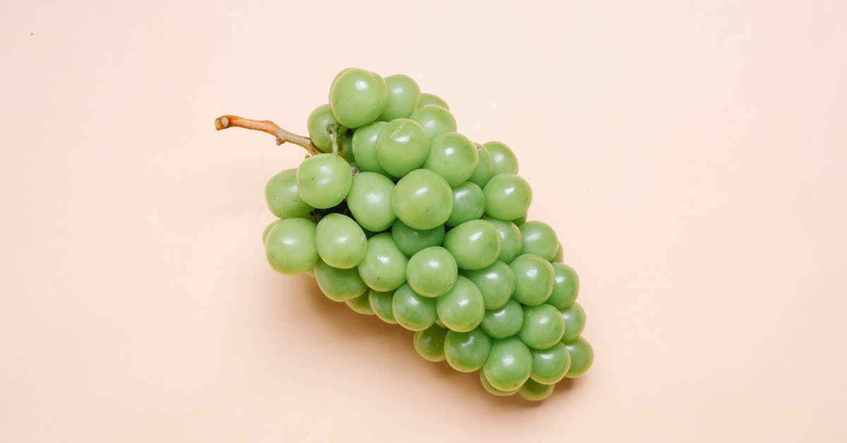 How did Grape juice from My Hero Academia manage to pass the UA entrance exam? - Top view of bunch of fresh delicious green grapes lying on beige surface
