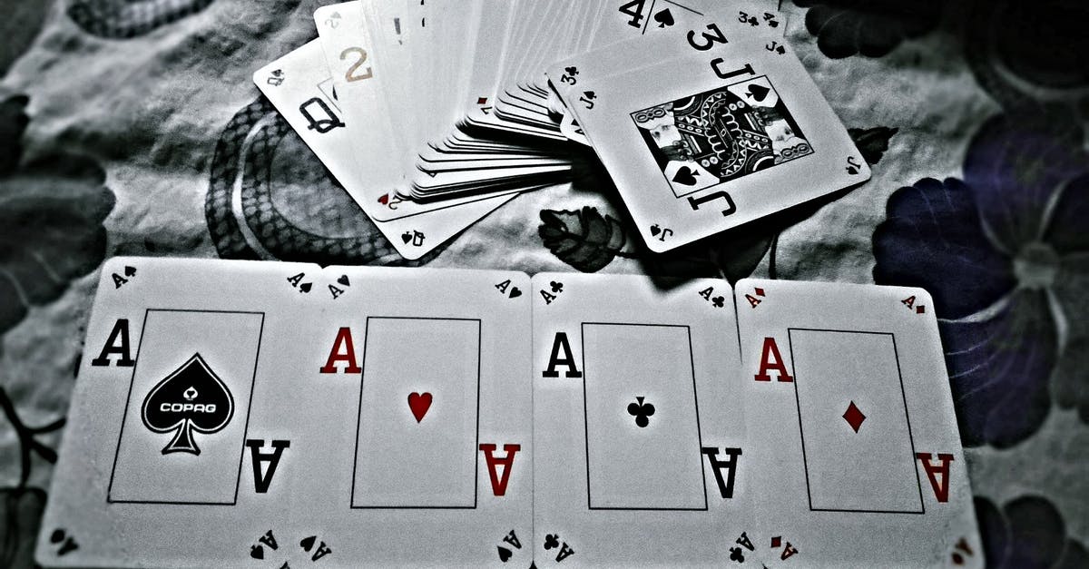 How did James Bond win poker in Casino Royale? - Grayscale Photography of Playing Cards Placed on Cloth