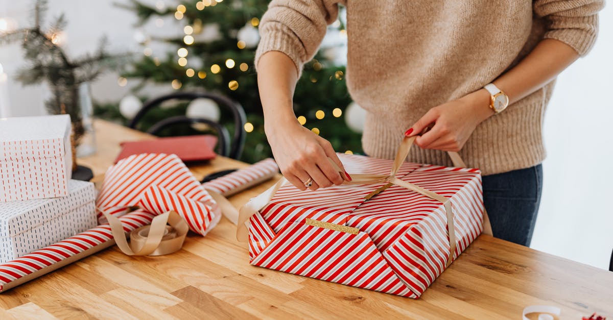 How did Joy escape? - Woman Wrapping Gift near Christmas Tree