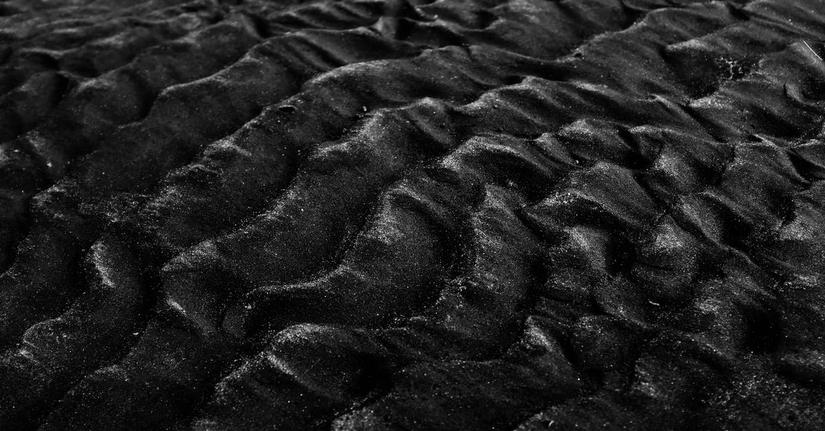 How did Kryptonite come to earth? - Grayscale Photography Of Sand