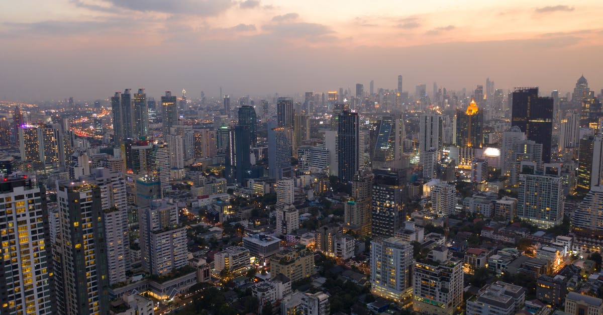 How did Peter rise so high? - Aerial view of cityscape of modern megapolis district with high rise buildings and skyscrapers against cloudy sunset sky