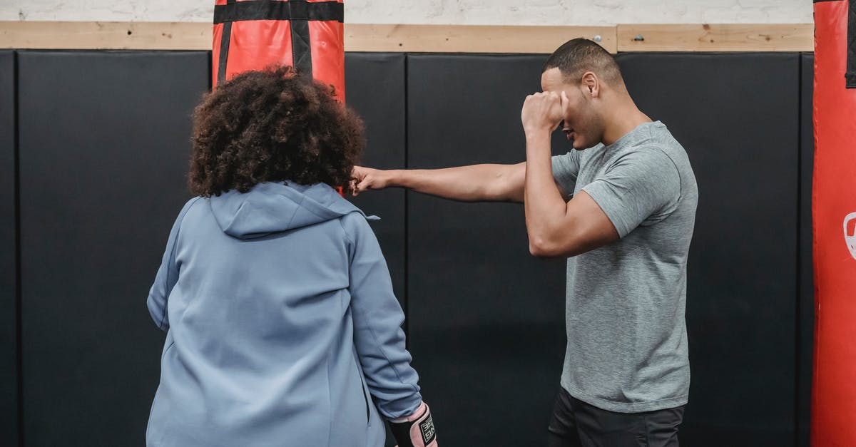 How did Sia learn to fight in the movie Baaghi? - Ethnic trainer showing exercise to female in boxing club