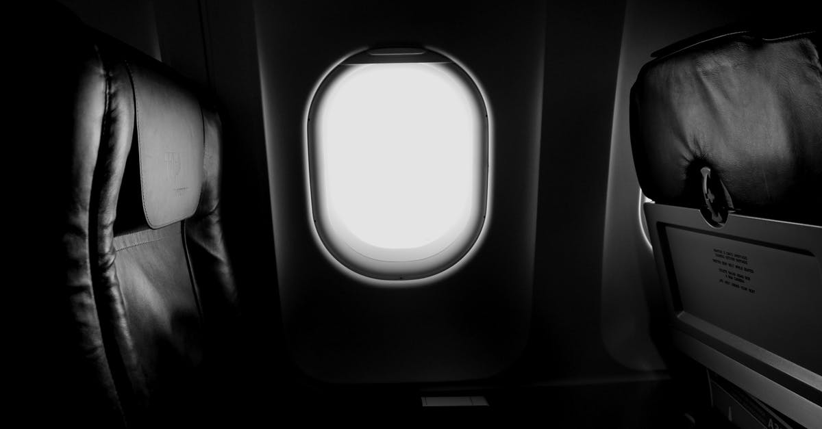 How did the Horsemen reach the plane in a truck? - Grayscale of Airplane Window and Chair