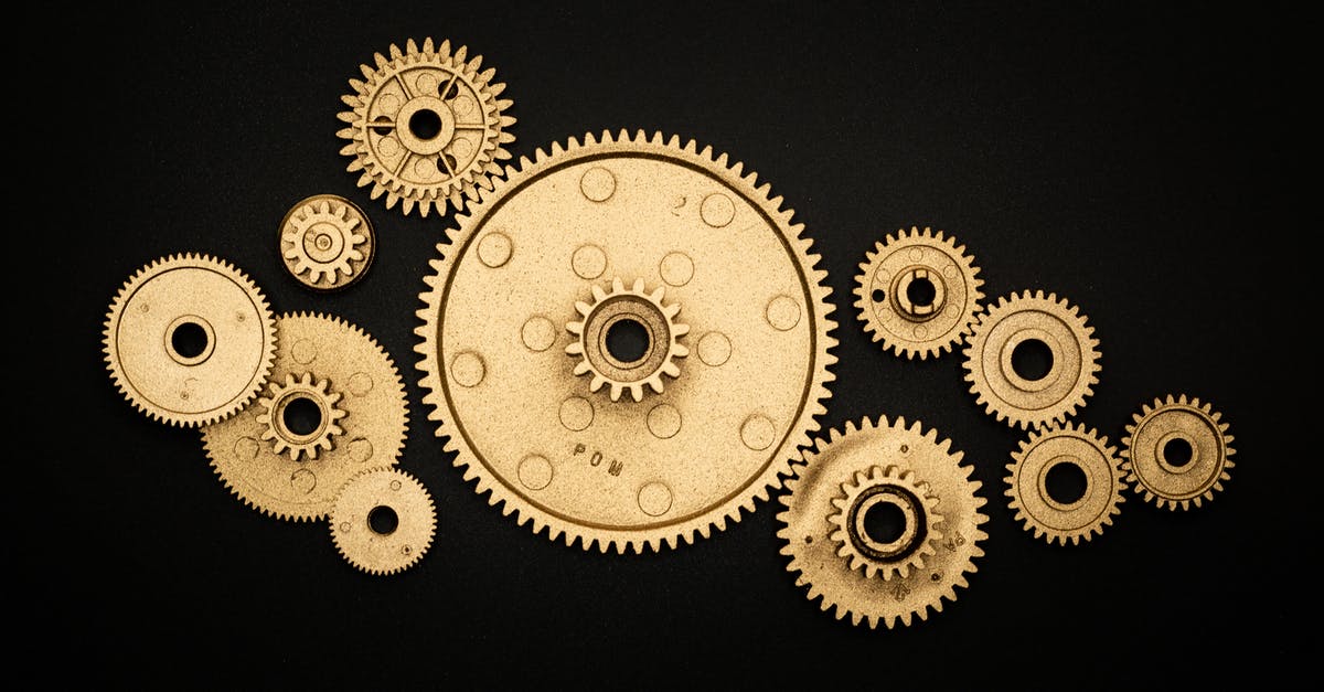 How did the machine work before this realisation? - Photo of Golden Cogwheel on Black Background