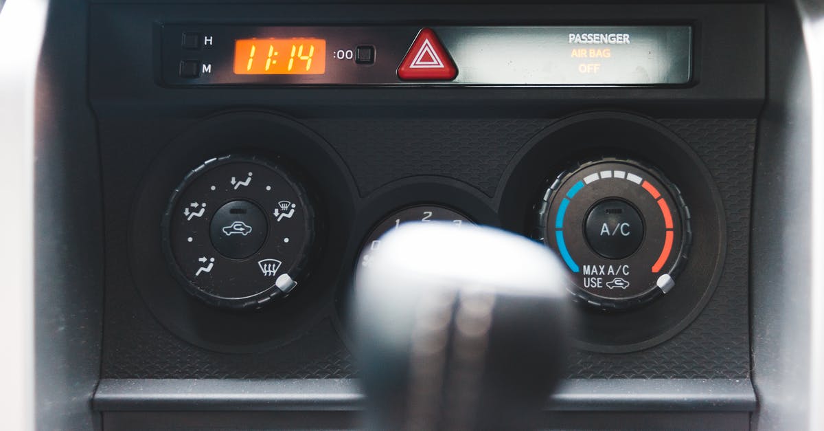 How did the time machine explode? - Blurred gear shift against dashboard with buttons and electronic clock in car in daytime