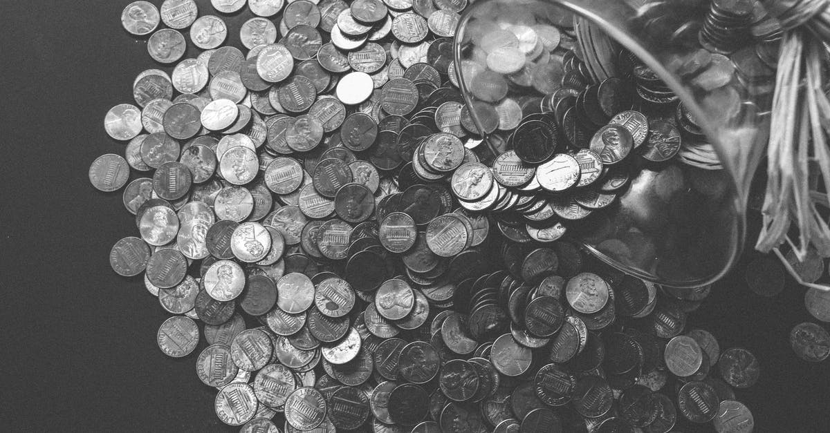 How did the treasure finally end up on Isla De Muerta? - Grayscale Photo of Coins