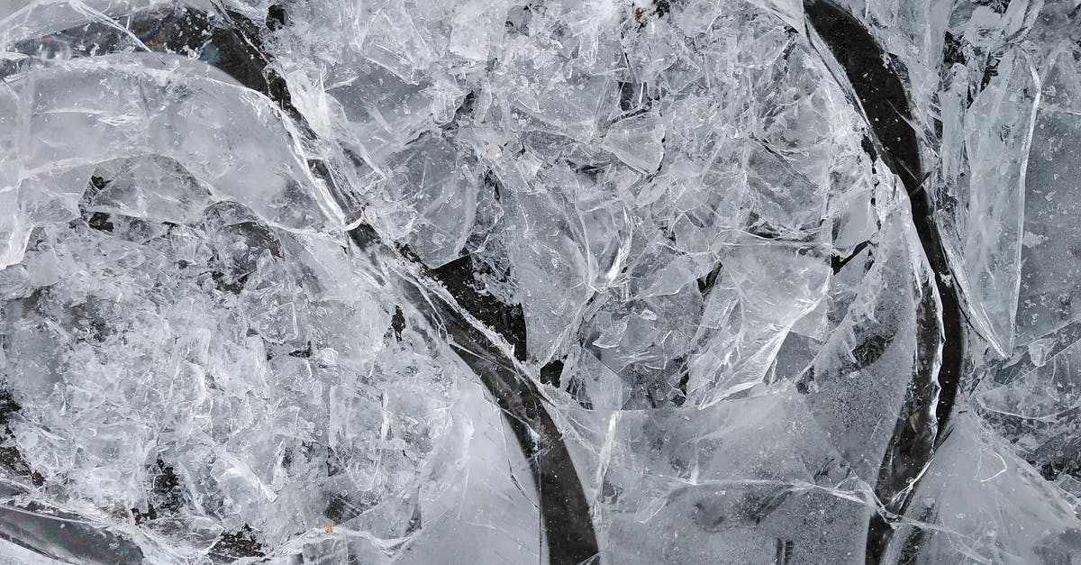 How did they achieve the crack in the ice scene? - Top view of fragile ice broken into small thin transparent pieces in frosty weather