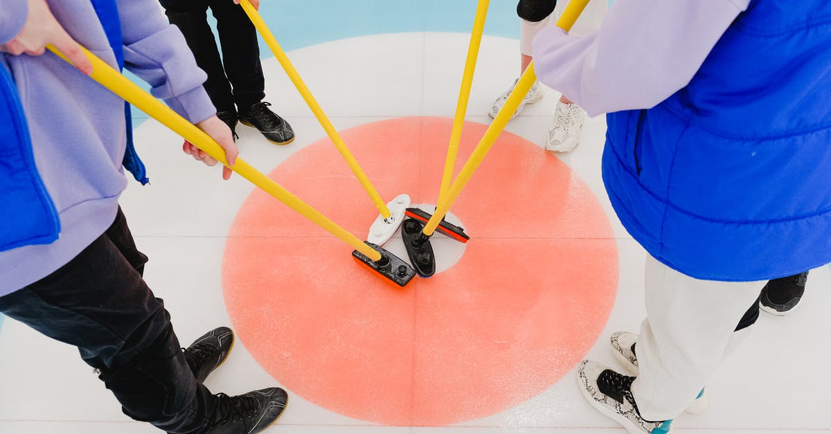 How did they achieve the crack in the ice scene? - Crop curlers connecting brooms on floor
