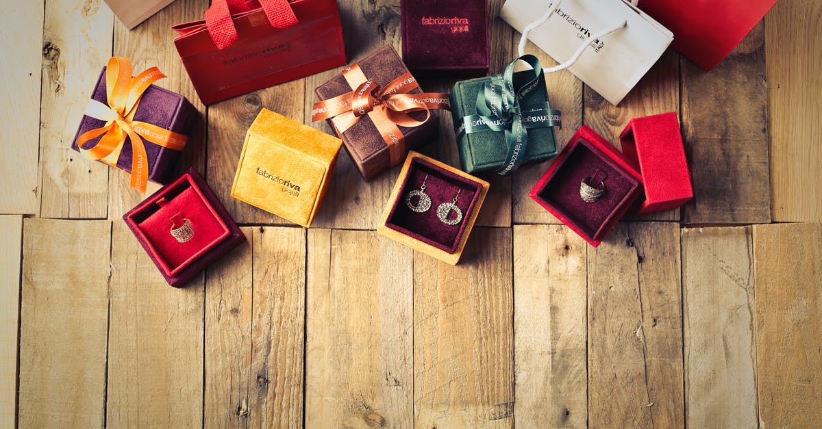 How did they fill the bags with paper in Ocean's Eleven? - Assorted Gift Boxes on Brown Wooden Floor Surface