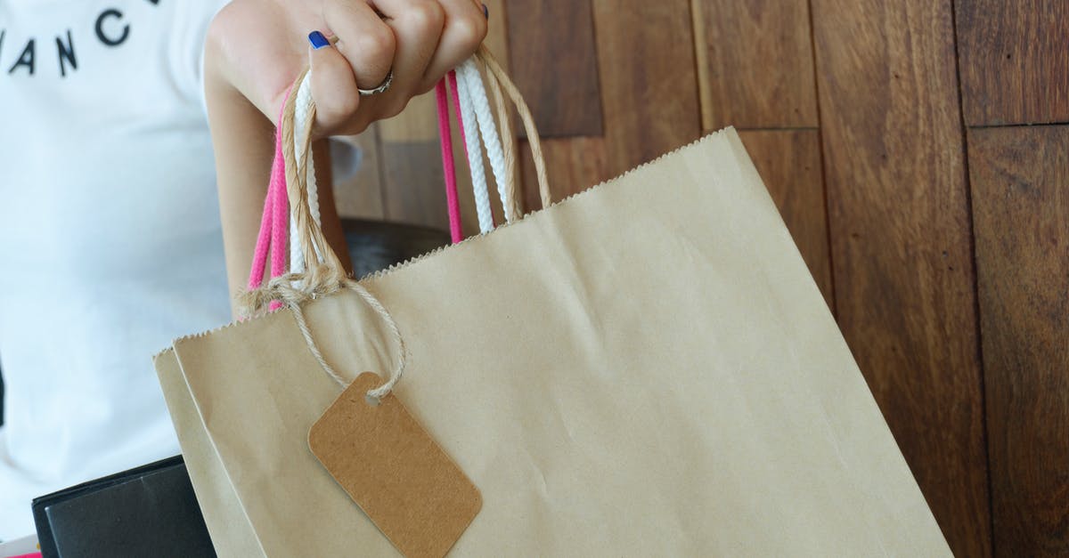How did they fill the bags with paper in Ocean's Eleven? - Person Holding Shopping Bag