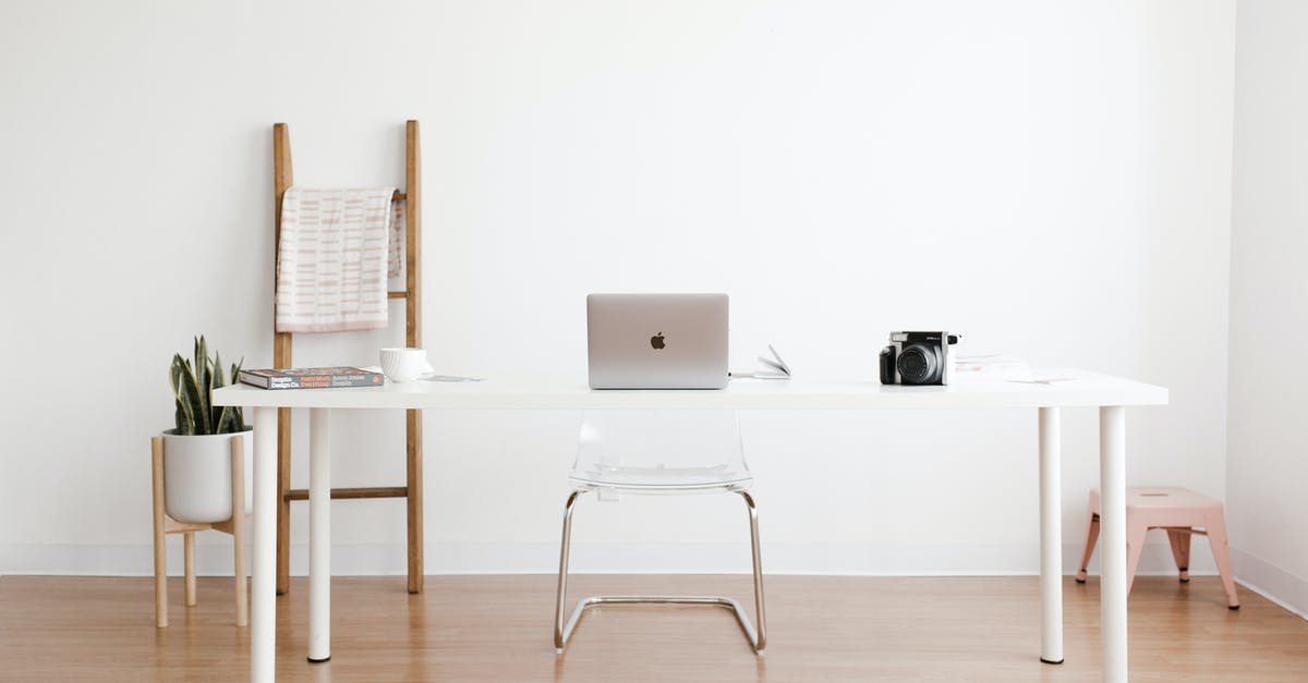 How did they toss the ladder to the other end? - Silver MacBook on White Table