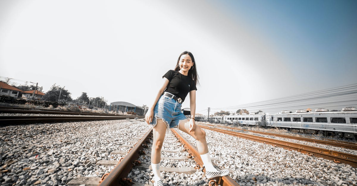 How did this person gain possession of the Infinity Stones? - Woman in a Black Shirt Posing on a Railway Track