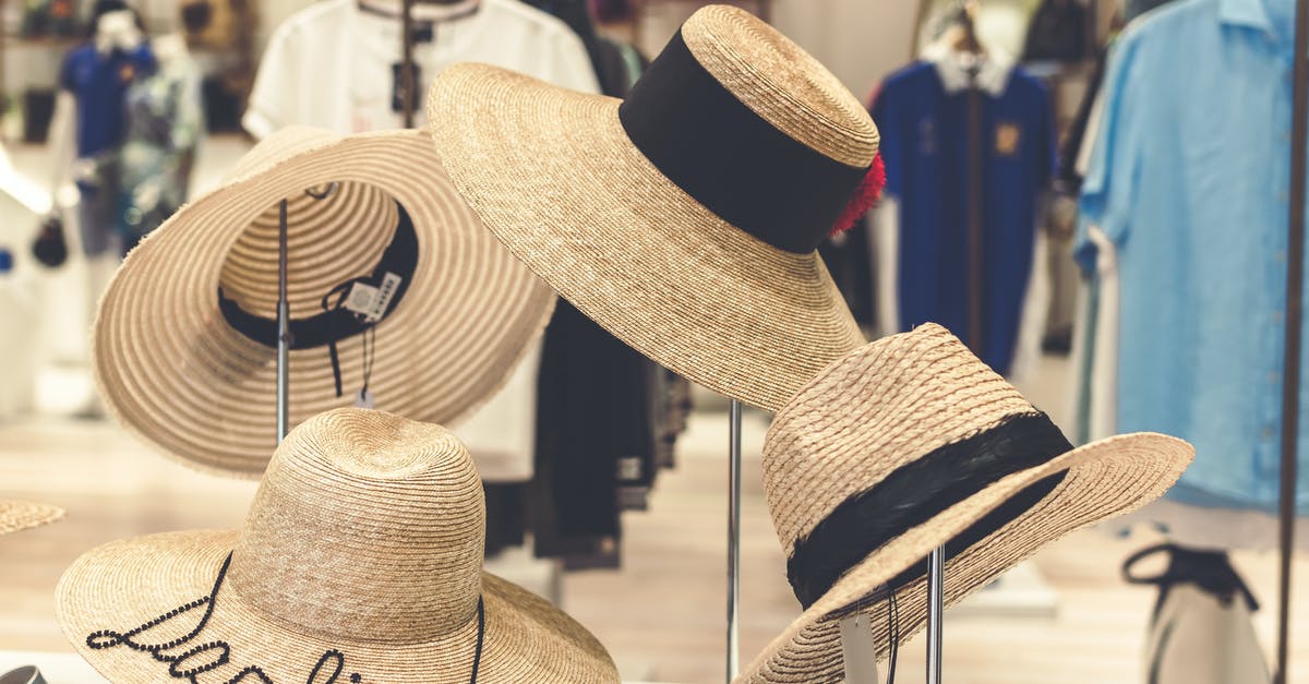 How do inverted objects work in Tenet? - Four Brown Straw Hats Display