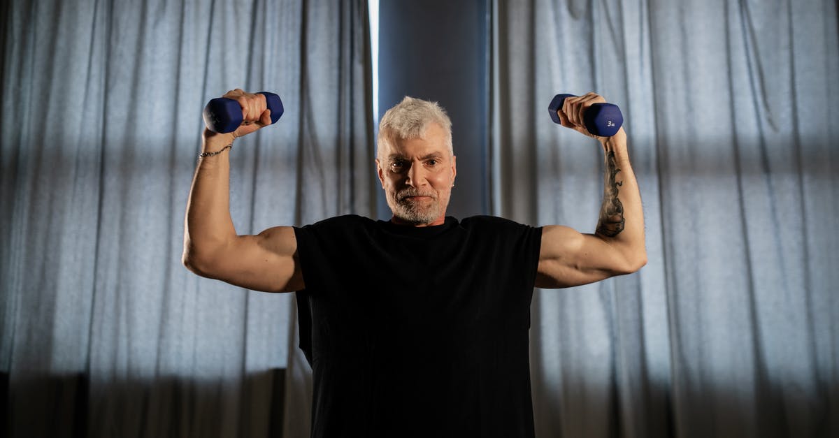 How do the Dallas movies fit between the old and new shows? - An Elderly Man Lifting Dumbbells