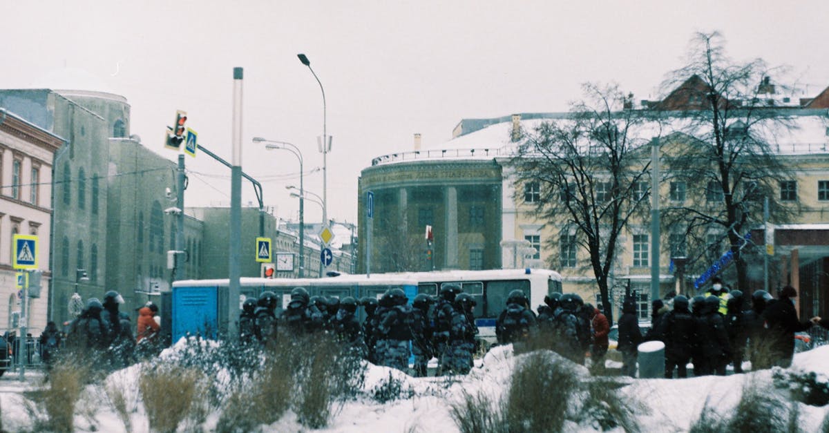How do the other 5 Winter Soldiers get subdued and stored in cryogenic tubes? - Riot Police Group on the Street in Winter