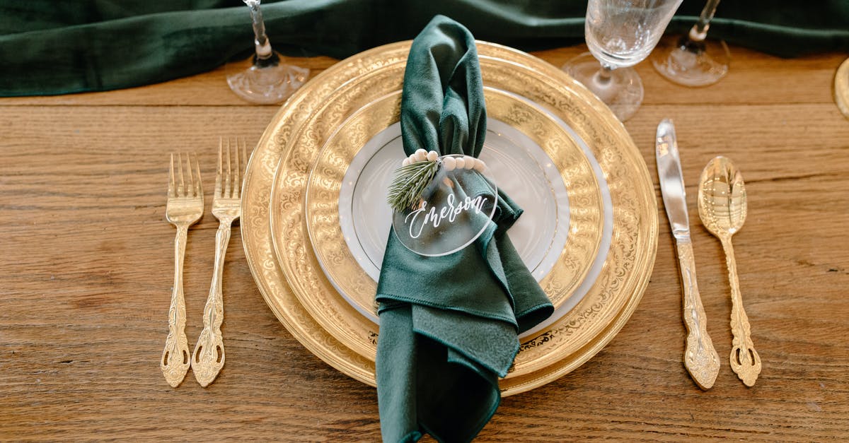 How do we know the names of the hitmen from Fargo? - Table setting with elegant tableware and personalized napkin ring