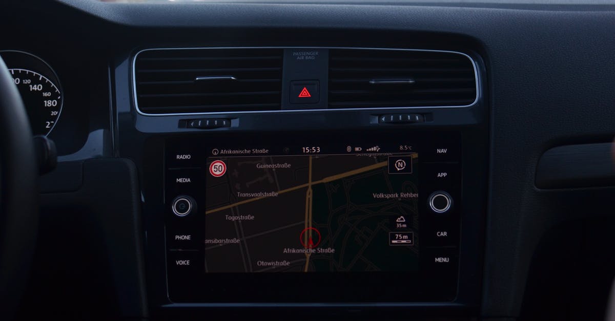 How does a Camera move freely inside a car in a movie scene? - Interior of modern car with steering wheel and navigation system showing route through city streets