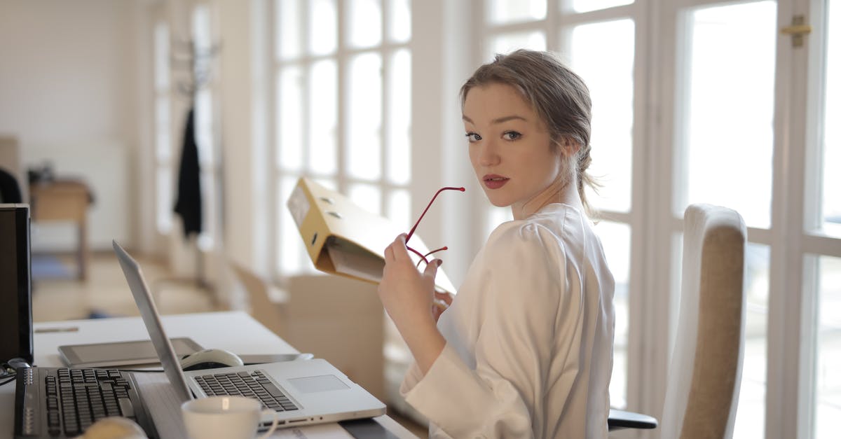 How Does Gandalf Keep Getting his Staff Back? - Elegant businesswoman with folder in office