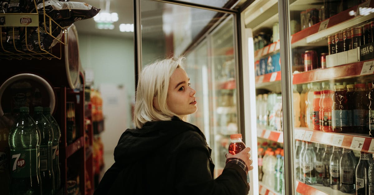 How does Jessica Jones drink but not get drunk? - Woman Buying a Drink