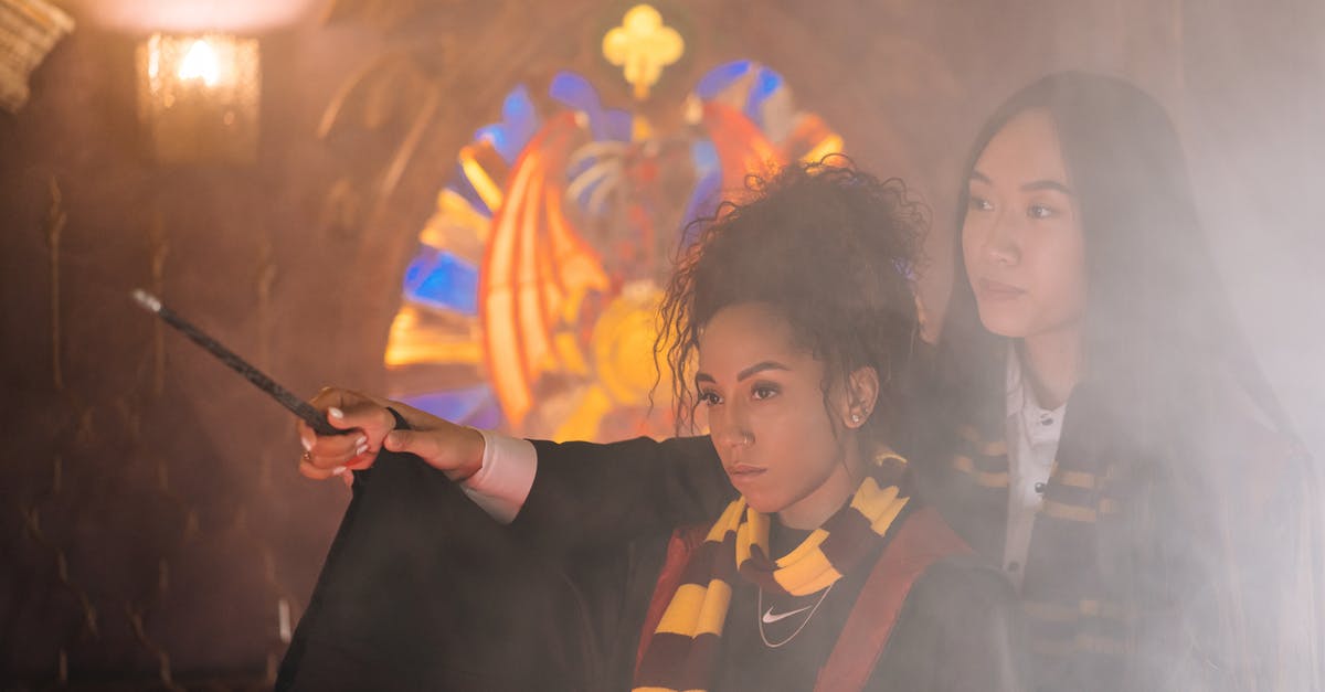 How does Percival Graves use magic without his wand in Fantastic Beasts? - A Woman Guiding Her Student while Holding a Wand