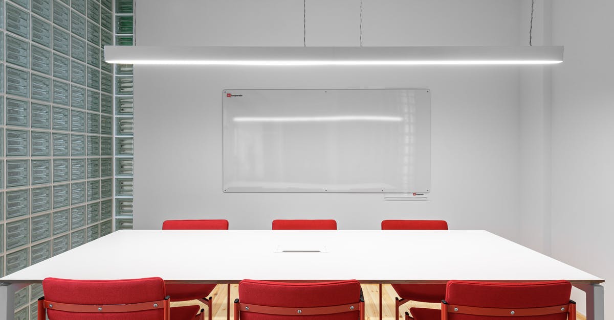 How does the Red Matter singularity work? - Interior of office with white table near red stools and whiteboard on wall near lamp and glass wall