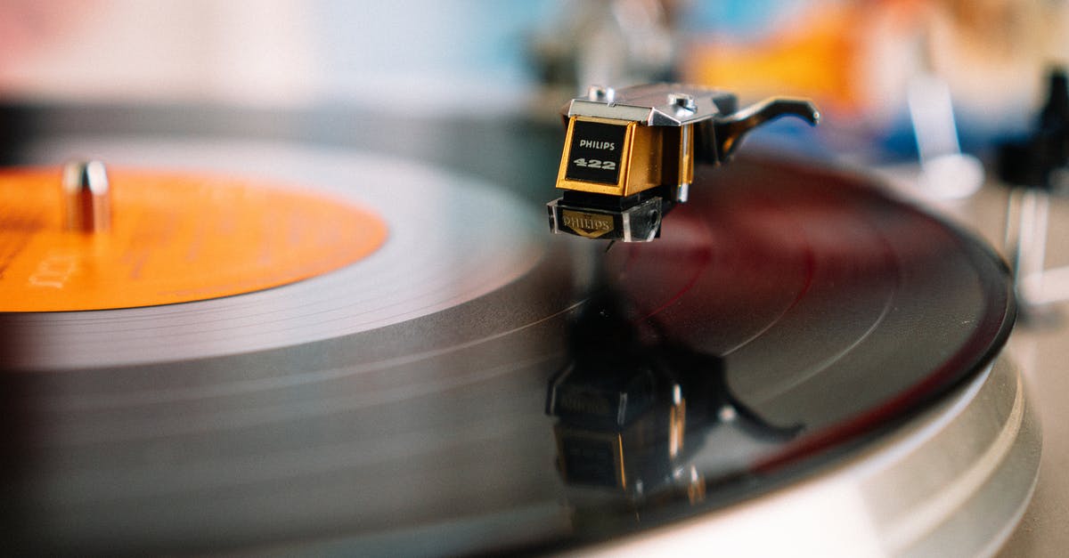 How does William know what song to play? - Retro turntable playing vinyl disc in living room