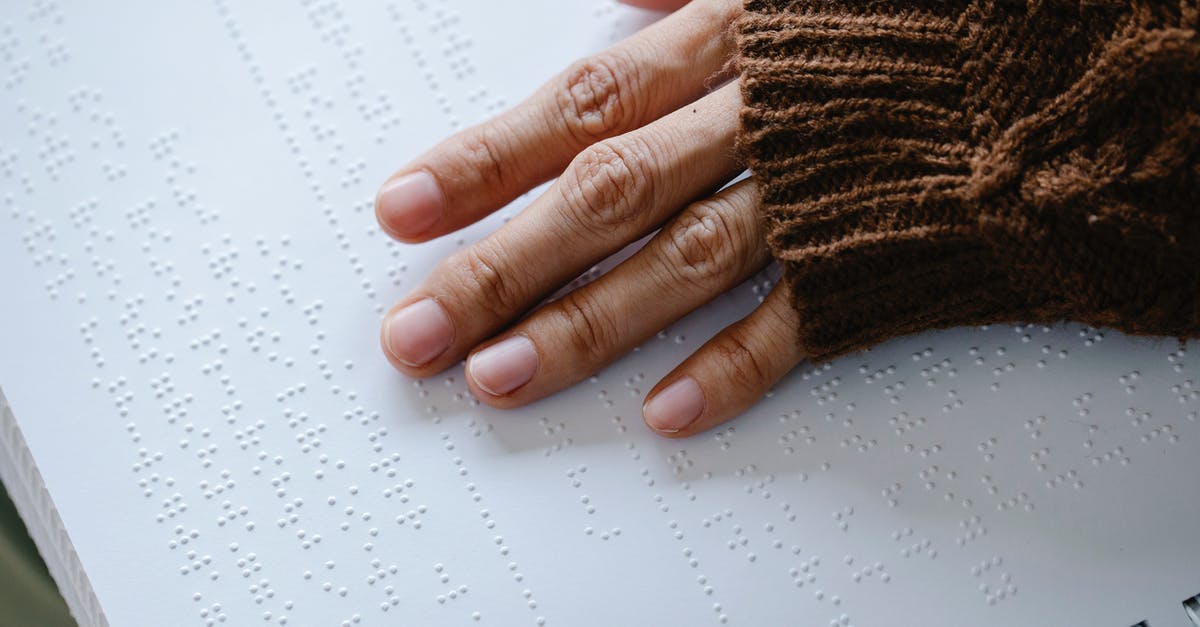How far does the depiction of the pirates' characters match the book? - Close-Up Photo of Person Using Braille 