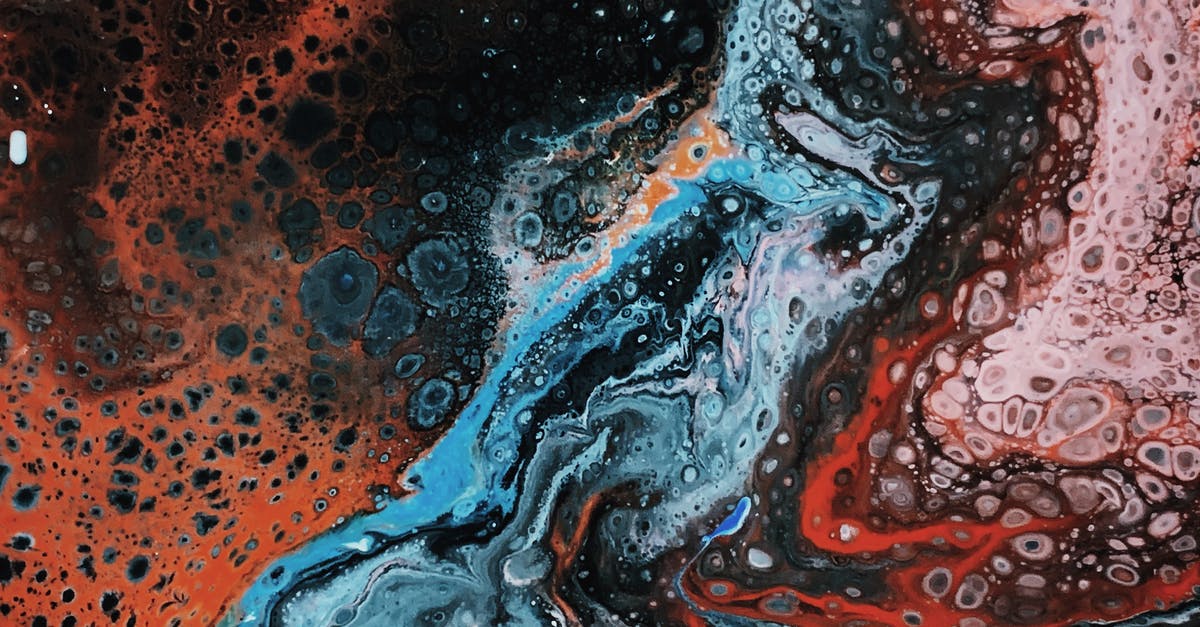 How is it that some of the Cylons are born and others grown in fluid? - Close-Up Photo Of Abstract Painting