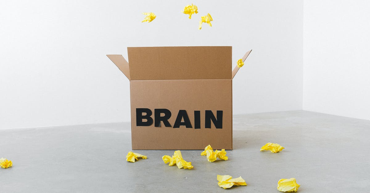 How is open head of Commander Data done? - Crumpled yellow paper pieces on floor near carton box with Brain title on white background