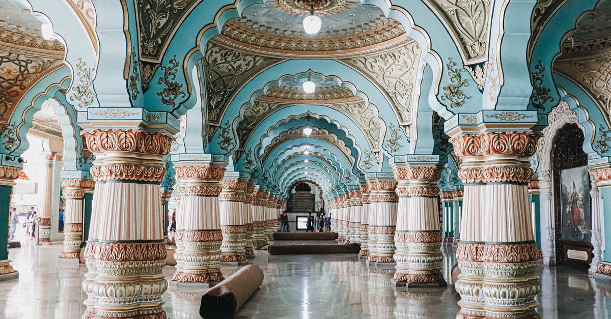 How many references to famous Holmeses are there in Sherlock? - Interior of historical royal palace with ornamental ceiling and various decorated columns in audience hall located in Mysore in India